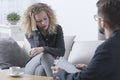 Worried woman during psychotherapy Royalty Free Stock Photo