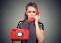 Worried woman receiving bad news on a phone Royalty Free Stock Photo