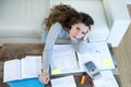 Worried woman suffering stress doing domestic accounting paperwork bills and invoices Royalty Free Stock Photo