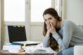 Worried woman suffering stress doing domestic accounting paperwork bills and invoices Royalty Free Stock Photo