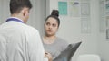 Worried woman talking to her doctor at the hospital Royalty Free Stock Photo