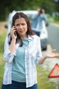 worried woman on telephone after car breakdown Royalty Free Stock Photo