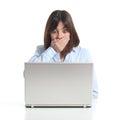 Worried woman watching a laptop