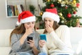 Worried women reading bad news in christmas