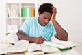 Worried young african man studying Royalty Free Stock Photo