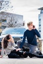 Worried young driver calling the ambulance after hitting acciden Royalty Free Stock Photo