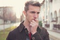 Worried young man biting nails Royalty Free Stock Photo