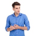 Worried young man holding his hands together Royalty Free Stock Photo