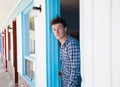 Young man looks out of the motel room Royalty Free Stock Photo