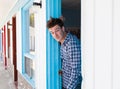 Young man looks out of the motel room Royalty Free Stock Photo