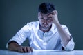 Worried young man sitiing at the table Royalty Free Stock Photo