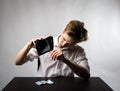 Young man in white and empty wallet Royalty Free Stock Photo