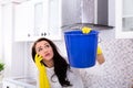 Woman Calling Plumber And Collecting Water Leaking From Ceiling Royalty Free Stock Photo