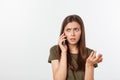 Worried young woman looks nervously, Female is nervous while talking on the phone, feels frustrated and worrying phone