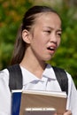 Worrisome Minority Girl Student With Textbooks