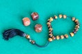 Worry beads and three wooden dices with six points