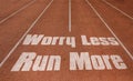 Worry Less Run More written on running track, New Concept on running track text in white color