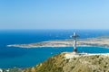 Worship cross upon the Orthodox chapel on hill of Caucasian mountain, against the background of sea bay of the