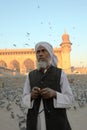 Worshiper and beads at Mecca Masjid mosque Royalty Free Stock Photo