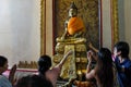 Worshiping and decorating Buddha statue