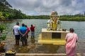 Worshippers offering prayers at the sacred lake of Ganga Talao in Mauritius