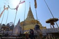 Worshippers paying respects, circumambulating the golden gilded stupa at Wat Phra That Chae Haeng, a Thai Buddhist temple in Nan Royalty Free Stock Photo