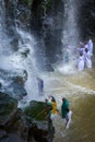 Worshippers praying in a waterfall