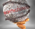 Worthlessness and hardship in life - pictured by word Worthlessness as a heavy weight on shoulders to symbolize Worthlessness as a