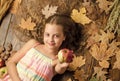 Would you like one. Little girl giving apple. Organic and natural food for kids health. Small girl likes the taste of Royalty Free Stock Photo