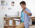 Would you like to know the secret to success. A handsome young ethnic businessman holding a tablet while pointing at the