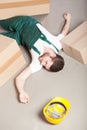 Wounded warehouse worker lying on the floor