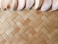 woven bamboo texture with garlic Royalty Free Stock Photo