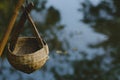 Woven bamboo water bucket on natural light background Royalty Free Stock Photo