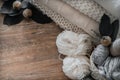 A woven basket with white thread for knitting and knitting needles. White sweaters and yarn for knitting closeup. Place for text Royalty Free Stock Photo