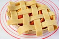 Woven dough on the pie plate for lattice top crust of a homemade apple pie Royalty Free Stock Photo