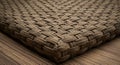 Woven mat made of natural fibers, featuring a tight, interlocking pattern. The mat has Royalty Free Stock Photo