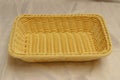 Woven rectangular yellow bread basket. Handmade wooden wicker food container Royalty Free Stock Photo