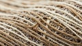 Woven texture featuring a network of intertwined beige and brown Royalty Free Stock Photo