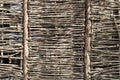 Woven from thin rods textured fence Royalty Free Stock Photo