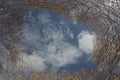 Woven wicker against sky. Abstract background.