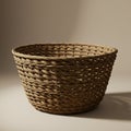 A woven wicker basket with an open design and circular shape, featuring a sturdy and Royalty Free Stock Photo