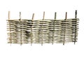 Woven wooden fence at ranch on white background