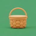 A woven yellow basket with a handle sits on a green background Royalty Free Stock Photo