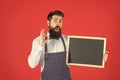 Wow. Bearded man show OK holding blackboard. School enrolment. Chalkboard for enrolment information