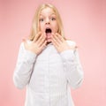 Beautiful teen girl looking suprised on pink Royalty Free Stock Photo