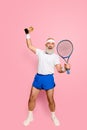 Wow Competetive best cool healthy modern successful active grandpa with big tennis equipment and reward raised in hand