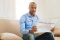 Shocked man reading a newspaper Royalty Free Stock Photo