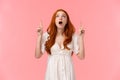 Wow so cool, check it out. Waist-up portrait speechless, curious and fascinated redhead caucasian female in white dress