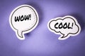 WOW and COOL text on speech bubbles. Purple background Royalty Free Stock Photo