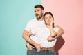 Wow. Doubtful pensive couple with thoughtful expression making choice against pink background Royalty Free Stock Photo